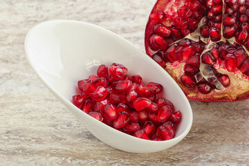 Ripe red Pomegranate seeds in the bowl