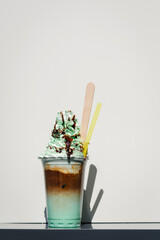 mint chocolate milkshake to take away in a plastic cup