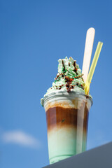 mint chocolate milkshake to take away in a plastic cup