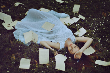 Young woman among written thoughts
