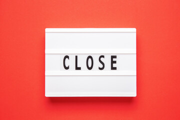 Lightbox with word close on red background