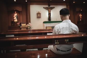 Christian man asking for blessings from God,Asian man praying to Jesus Christ