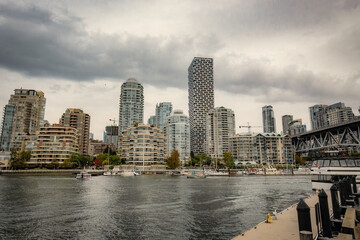 Obraz premium Granville island marina and residential buildings in Vancouver downtown Canada