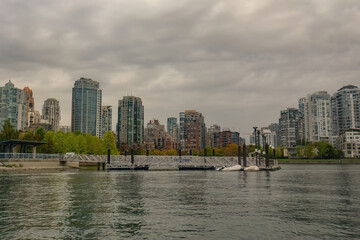 Fototapeta premium Granville island marina and traditional boats with False Creek writing in Vancouver downtown Canada