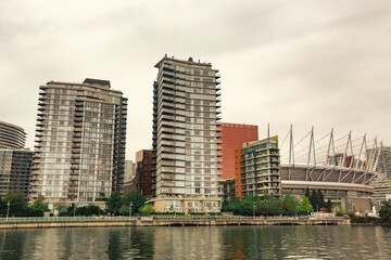 Fototapeta na wymiar Granville island marina and residential buildings in Vancouver downtown Canada