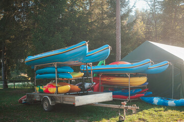 Kayaks for rent on the river placed on a car trailer