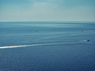 Fototapeta na wymiar seascape of a blue water of the mediterranean sea seen from lindos