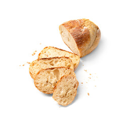 Wheat bread and slices of bread on a white background top view.