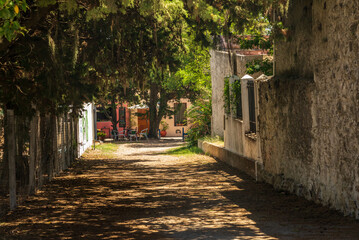 Small cobblestone street leading to restaurant in Colonia del Sacramento Uruguay