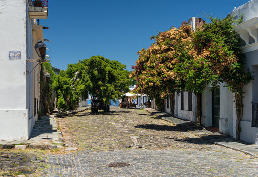 Small Cobblestone Street Leading To Restaurant In Colonia Del Sacramento Uruguay