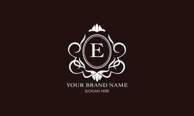 Vector illustration of letter E logo template. Classic floral monogram with decorative elements.