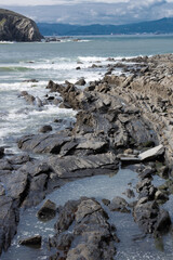 Beautiful vertical image of rocks in the sea