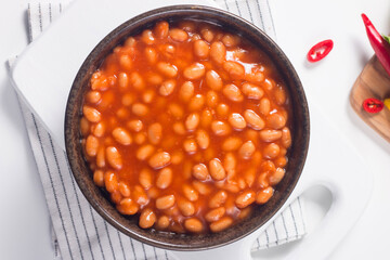 Chili beans on wooden table background. Kidney beans and vegetable Mexican food. 
