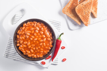 Chili beans on wooden table background. Kidney beans and vegetable Mexican food. 