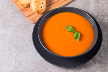 Tomato soup with basil.  Healthy, vegan and dieting lunch and dinner concept. Gazpacho. 