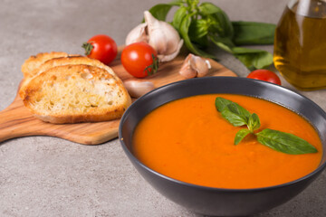 Tomato soup with basil.  Healthy, vegan and dieting lunch and dinner concept. Gazpacho. 