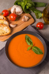 Tomato soup with basil.  Healthy, vegan and dieting lunch and dinner concept. Gazpacho. 
