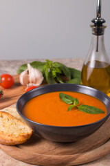 Tomato soup with basil.  Healthy, vegan and dieting lunch and dinner concept. Gazpacho. 