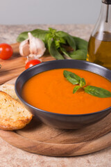 Tomato soup with basil.  Healthy, vegan and dieting lunch and dinner concept. Gazpacho. 
