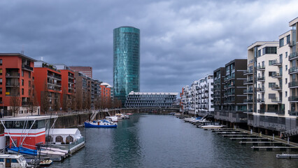 Fototapeta premium Frankfurt am Main, Germany - January 29, 2023: West Harbor living area in Frankfurt am Main, Germany, by overcast weather.
