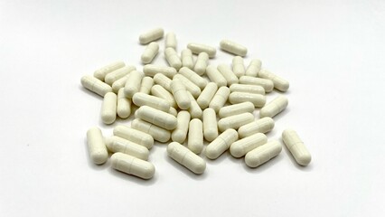 Antibiotic capsule pills on white background. 