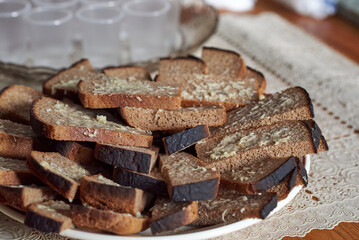 A slice of rye bread, greased with grated garlic