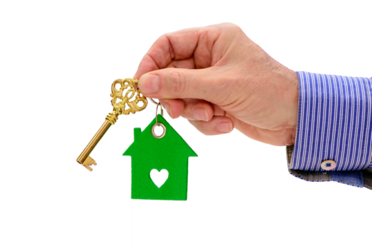 isolated home key in hand over transparent background