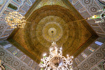 Fototapeta na wymiar Beautiful wooden ceiling with a chandelier at Zawiya of Moulay Idris II in the medina of Fez, Morocco