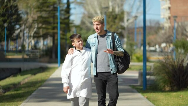 Father and son talking while going to school in Argentina