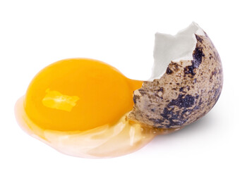 One broken raw quail egg with yolk isolated on white background.