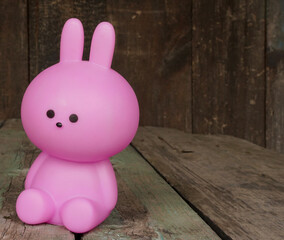 Close up Easter bunny rabbit statuette. Easter egg hunt in the garden. Selective focus, copy space....