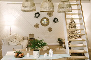 The interior of a beautiful light house decorated for New, Christmas tree, table, stairs
