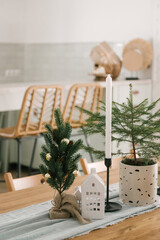The interior of a beautiful bright house decorated for the New, Christmas table in the kitchen