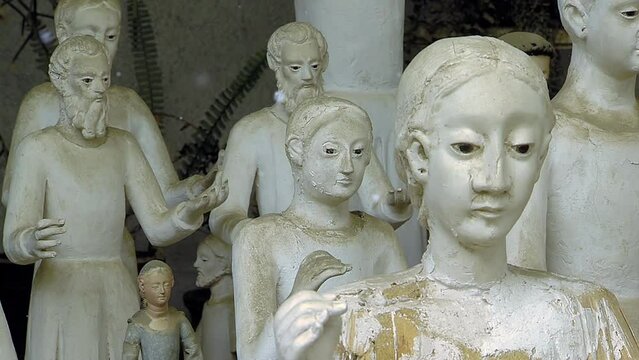 Religious Figures in the Workshop of a Bolivian Sculptor. Close Up. 4K Resolution.