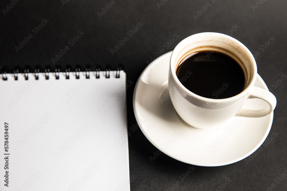 Poster coffee and notebook on the table