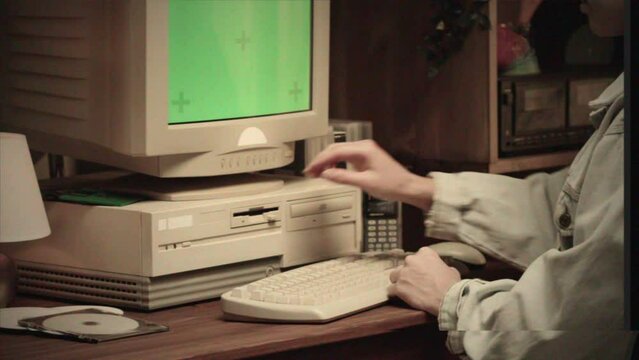 Vintage Retro PC, Using cd diskette for old computer. Music recorder, playing retro computer games. Vintage device for office, obsolete technology. 