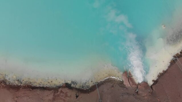 Hot geothermal pool of Hverir Myvatn Lake. Iceland blue water steam, aerial view in slow motion