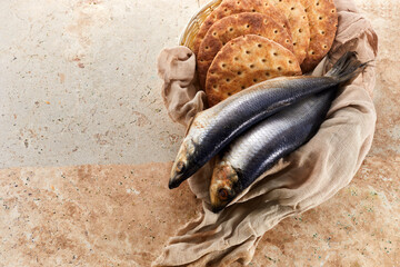Catholic still life of five loaves of bread and two fish