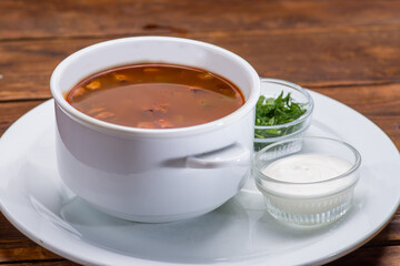 Tomato soup in a white bowl