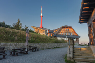 Television transmitter and chalets on Lysa Hora, beskid mountains, Czech republic at summer sunset...