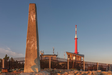 Concrete obelisk and meteorologist station and television transmitter on Lysa Hora, beskid mountains, Czech republic at summer sunset time.