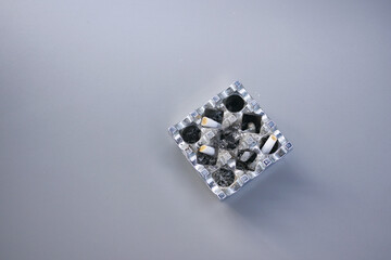 Close up burning cigarette in ashtray on table 