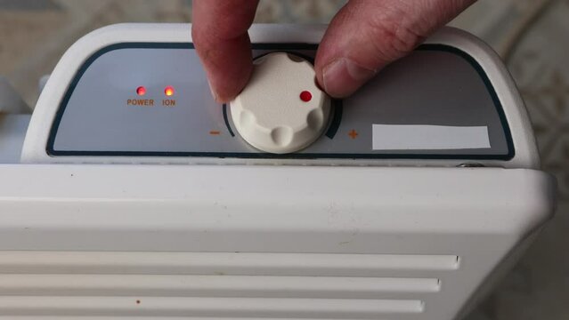 Thermostat dial of convector heater turns to maximum temperature setting.