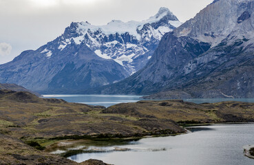 Fototapeta na wymiar Impressive mountains and a lake with turquoise water at Torres del Paine National Park in Chile, Patagonia, South America