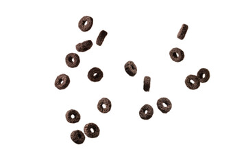 Chocolate rings cereal spill out into a bowl. Breakfast.
