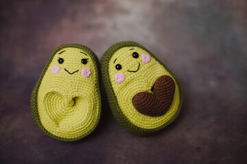 For avocado lovers, two green knitted avocados with a brown knitted heart that connects them into one toy, a family knitted toy for adults and children