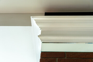 Ceiling moldings with an intricate crown in the inner corner. Home renovation, home decoration,...