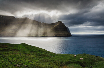 Dramatic sunlight, view from Vidoy island at Bordoy island in Faroe islands, Northern Europe