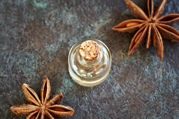 A bottle of aromatherapy essential oil with star anise