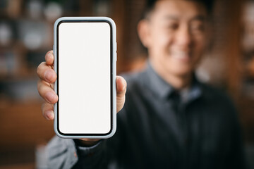 Mobile Mockup. Smiling Asian Man Showing Big Blank Smartphone With White Screen